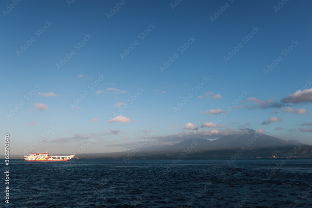 A Sunny Morning in The Bali Strait, With The Background of Mount Ijen and Mount Raung