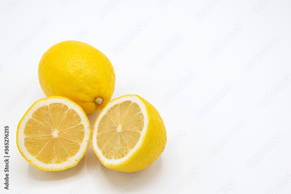 Yellow lemon fruit with a white background,.Isolate and copy space for text and design,Lemon is a citrus fruit with high vitamin C, Lime can be cooking for food and dessert. Yellow lemon fruit with a white background,.Isolate and copy space for text and design,Lemon is a citrus fruit with high vitamin C, Lime can be cooking for food and dessert.
