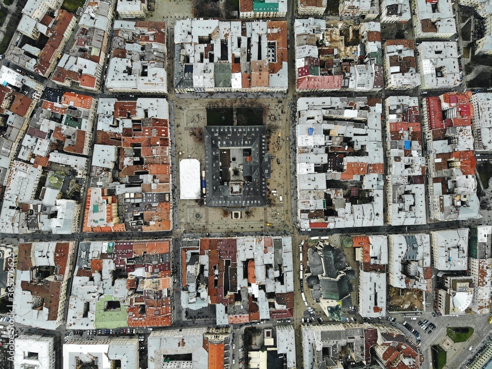 Aerial view from above of Lviv city, Ukraine. Beautiful drone photography. Main square and rooftop of city hall tower