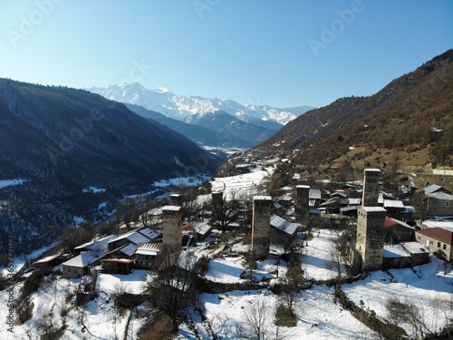 Winter Georgia. Svaneti Region, mountain city Mestia. Svan Towers. View from above, perfect landscape photo, created by drone. Aerial photo from travel.