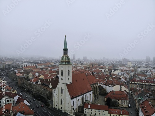 Slovakia, Bratislava. Historical old city centre. Aerial view from above, created by drone. Foggy day town landscape, travel photography.