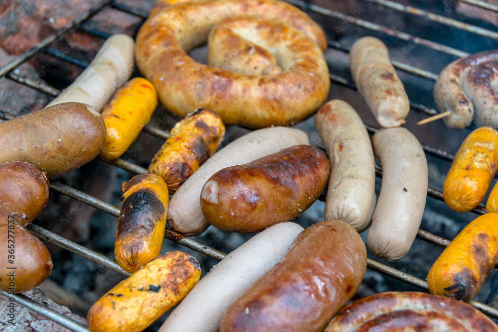 assorted meat sausages on the barbecue gril assorted meat sausages on the barbecue gril