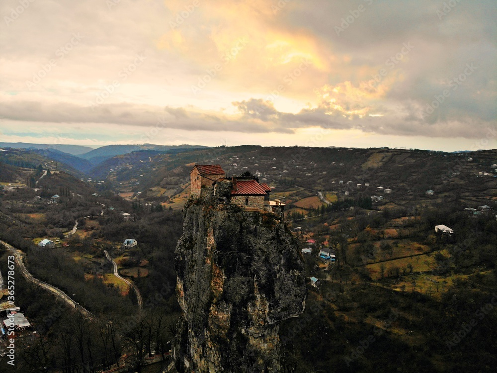 Beautiful aerial drone photography. Country Georgia from above. Mountain Monastery and Church of Katskhi, Chiatura region. Sunset aerial view