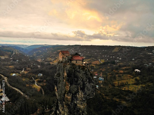 Beautiful aerial drone photography. Country Georgia from above. Mountain Monastery and Church of Katskhi, Chiatura region. Sunset aerial view