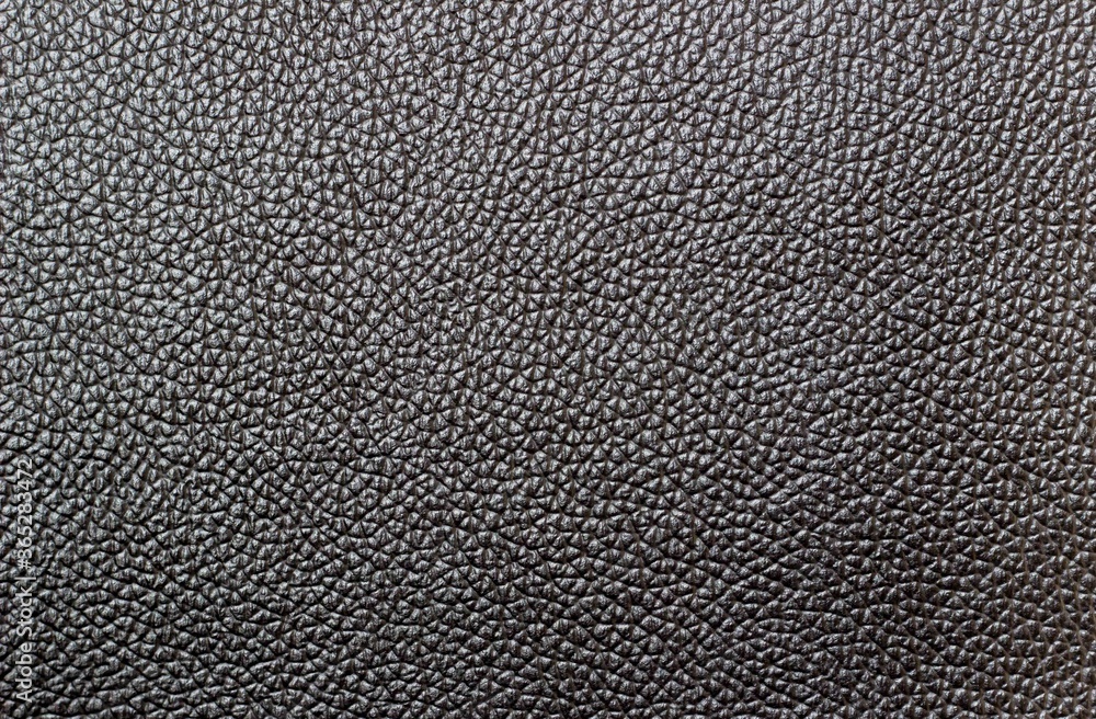Close-up of dark, black leather. Background, texture, pattern Close-up of dark, black leather. Background, texture, pattern