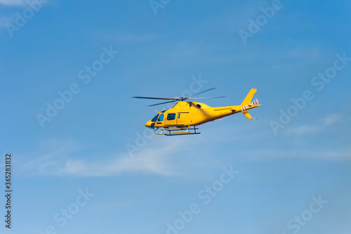 A helicopter flying in the dehesa of Extremadura, Caceres.