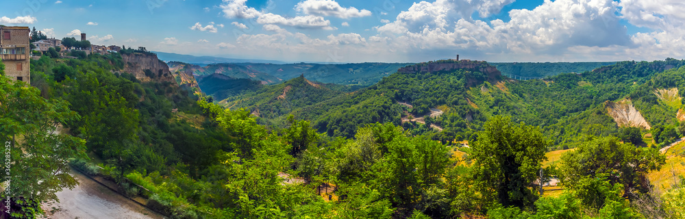 A panorama view from Lubriano towards the hill top settlement of Civita di Bagnoregio in Lazio, Italy in summer