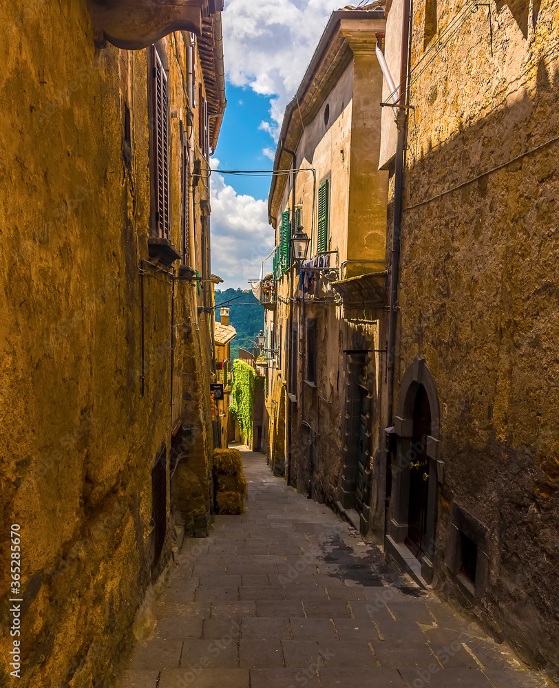 A rustic side street in the settlement of Bagnoregio in Lazio, Italy in summer