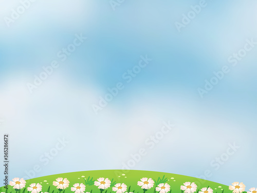 Blank bright blue sky background with some flowers
