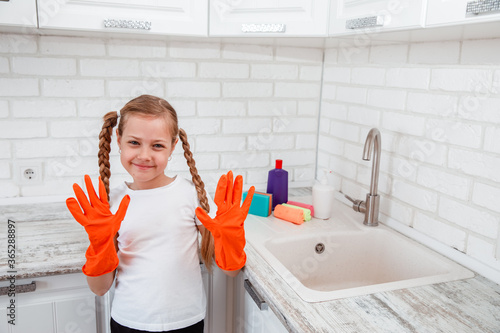 Obraz na plátně Chores for children . Girl is going to wash dishes