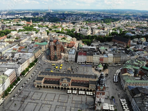Aerial photo from drone. The culture and historical capital of Poland. Comfortable and beautiful Krakow. The land of Legend. Old part of town,Main square, St. Mary's Basilica.