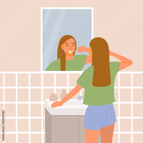Beautiful girl brushing her teeth in front of the bathroom mirror. A young woman in shorts and a t-shirt washes her face. Cute cartoon vector illustration.