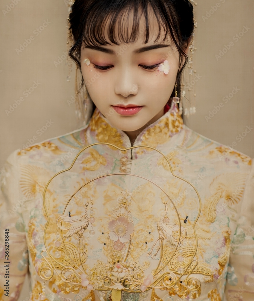 Asian woman in yellow costume Asian woman in yellow costume