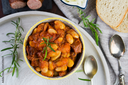 Stewed beans in tomato sauce with herbs and spices.  Top view. photo