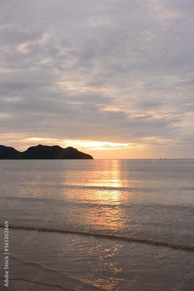 	
Early morning sea view. The sunrise view against the golden yellow sky