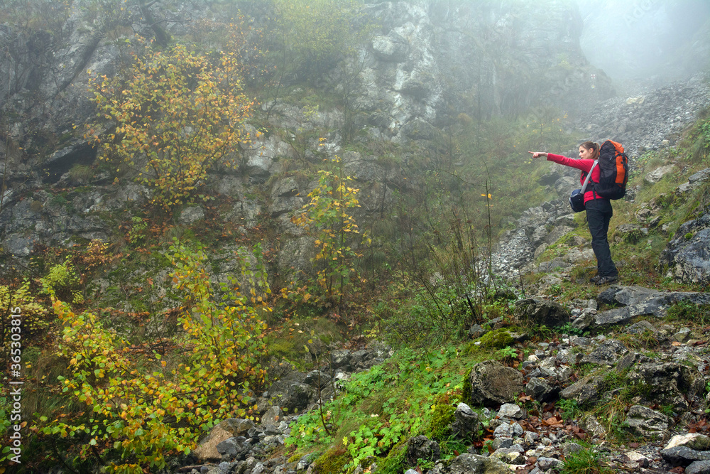 Obraz premium Young brunette girl trekking in Mehedinti Mountains, Romania, Europe