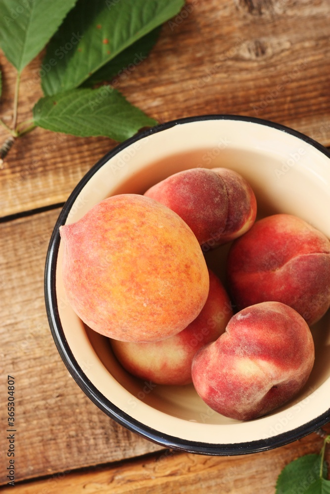 Juicy peaches on a wooden table macro 