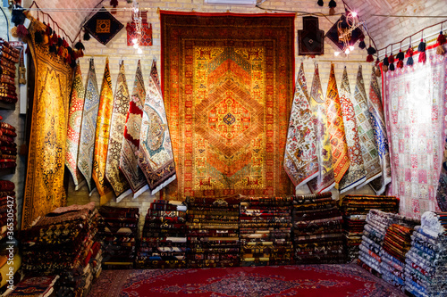 Traditional iranian carpets, rugs and scarfs shop in Isfahan bazaar. Esfahan bazaar is one of the oldest and biggest in Iran. photo