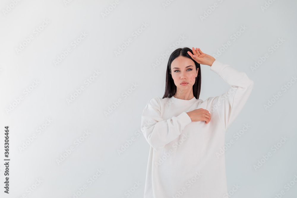 Portrait beautiful adult sports girl model on white background. hoody. logo. Portrait beautiful adult sports girl model on white background. hoody. logo.