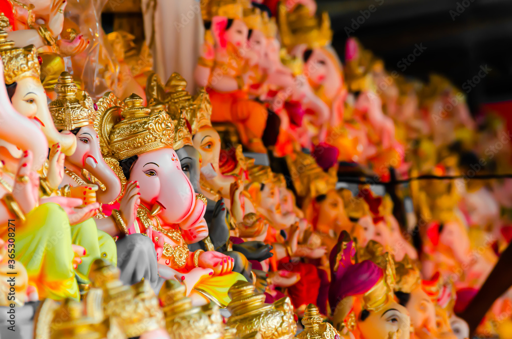 Decorated shops and idols for Ganesha Festival in India.