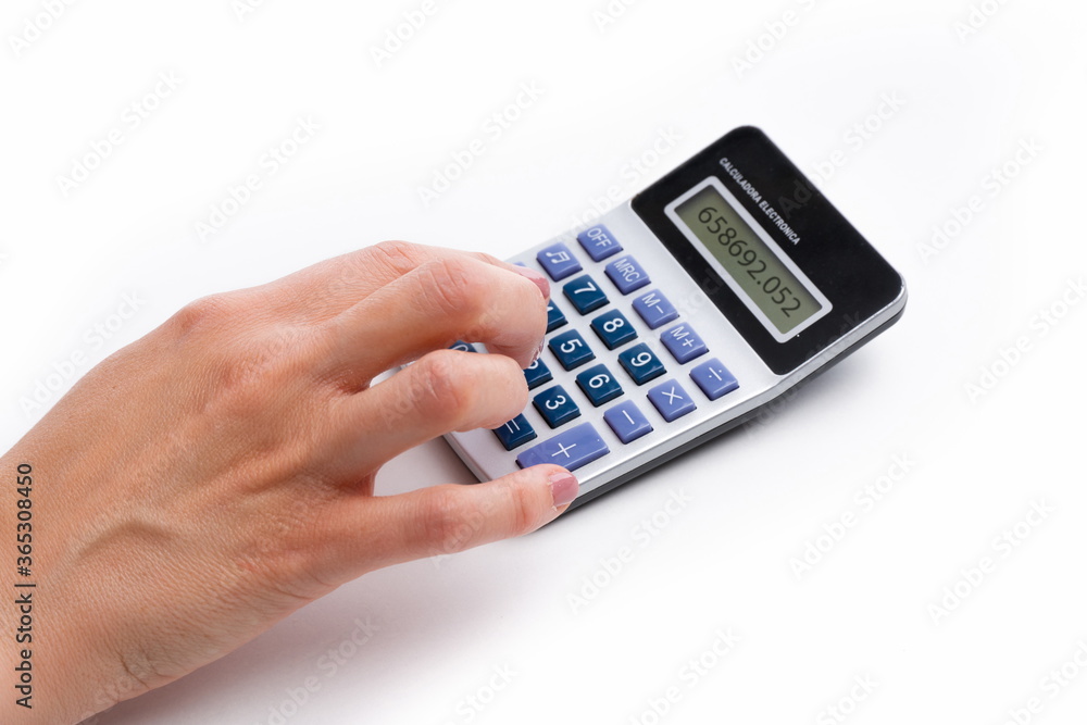 Woman hands typing on the computer on a brown table, mobile phone and tablet on the table Woman hands typing on the computer on a brown table, mobile phone and tablet on the table