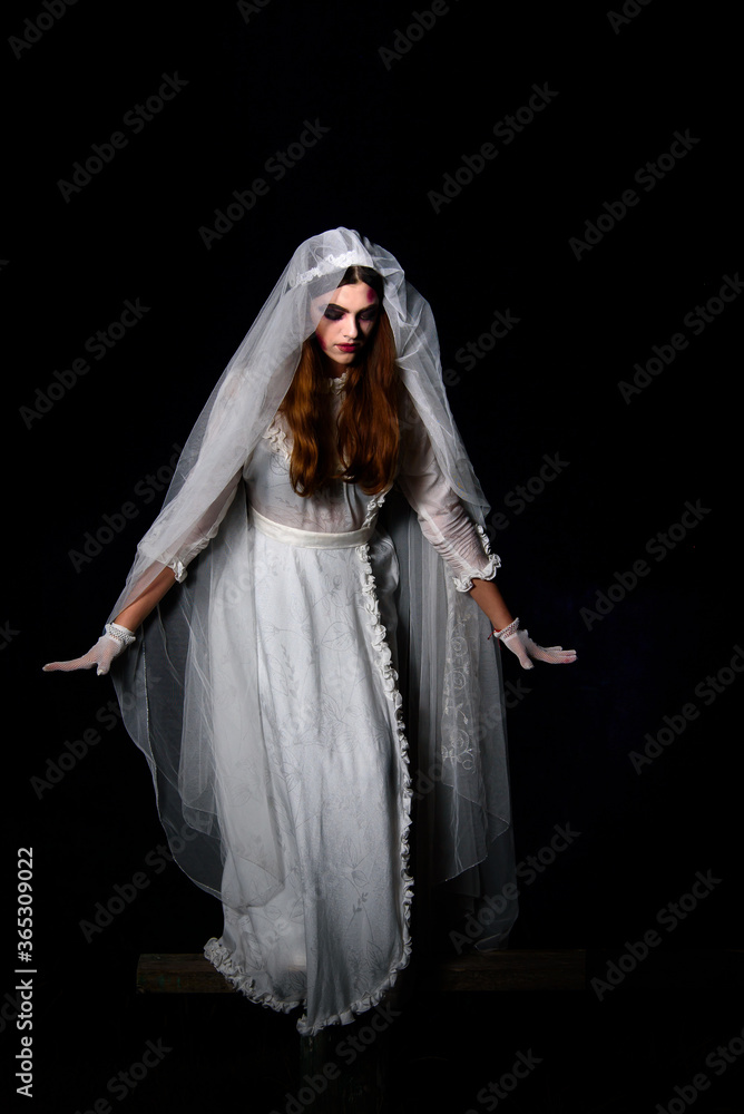 Creepy dead bride at night in a swamp. Halloween scene