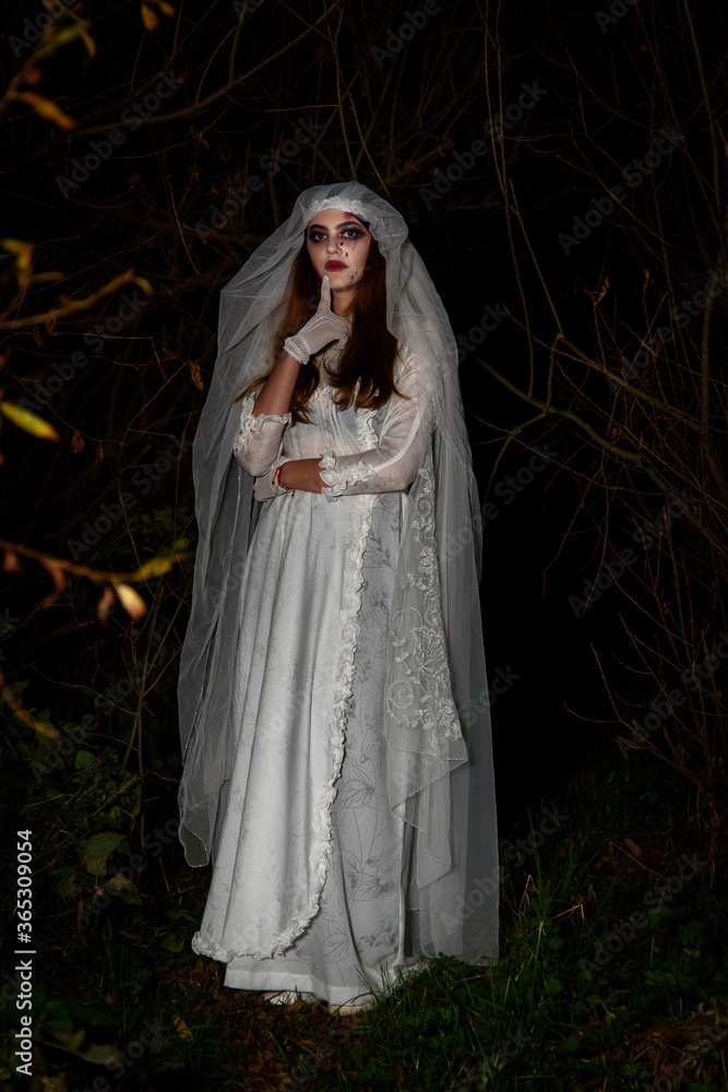 Creepy dead bride at night in a swamp. Halloween scene Creepy dead bride at night in a swamp. Halloween scene