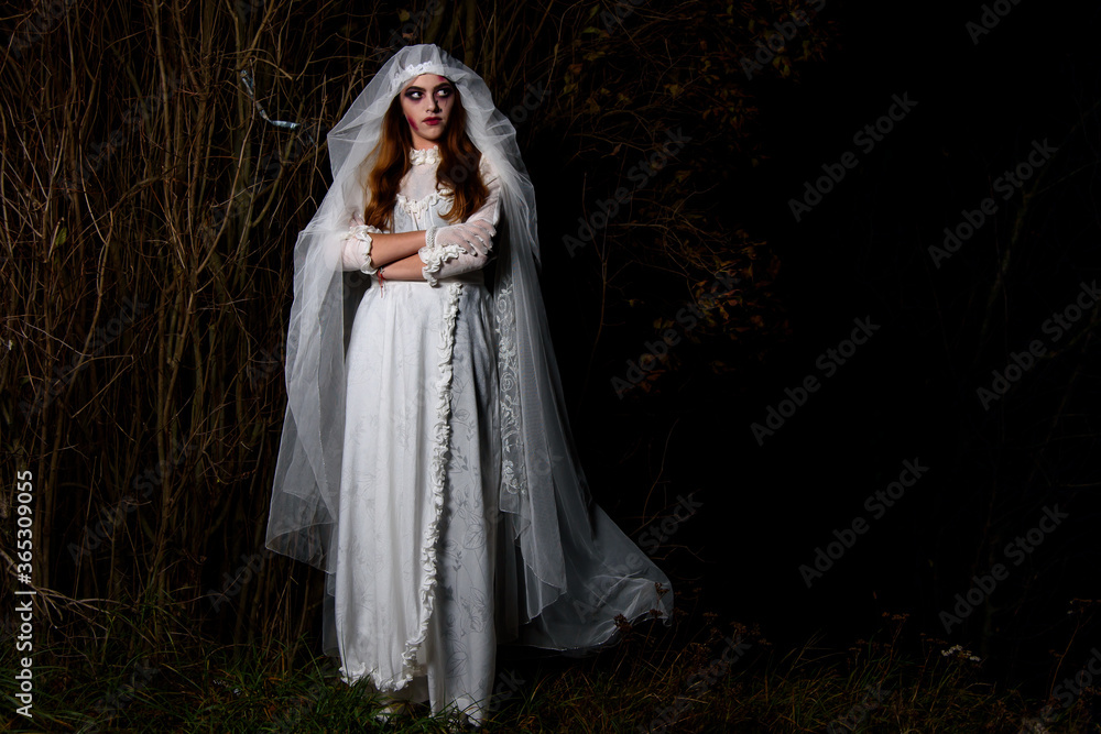 Creepy dead bride at night in a swamp. Halloween scene Creepy dead bride at night in a swamp. Halloween scene