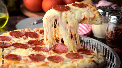 pepperoni pizza with melting cheese photo