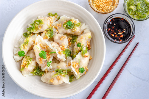 Shrimp Dumplings with Nam Jim Sauce in a White Bowl with Chopsticks Horizontal Directly Above Photo