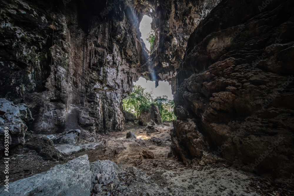 Limestone cave with shining light 
