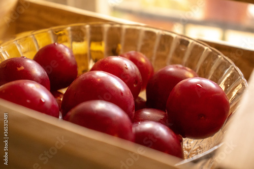 red plums with a wooden background 