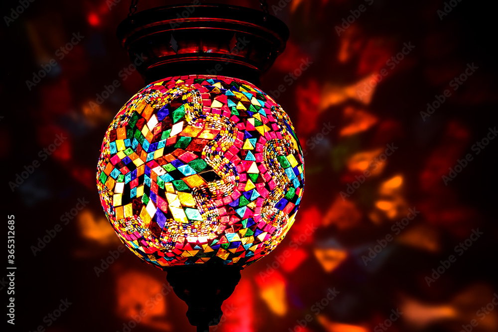 Obraz premium Colorful Traditional Eastern Hanging Lamp / lights reflecting on background