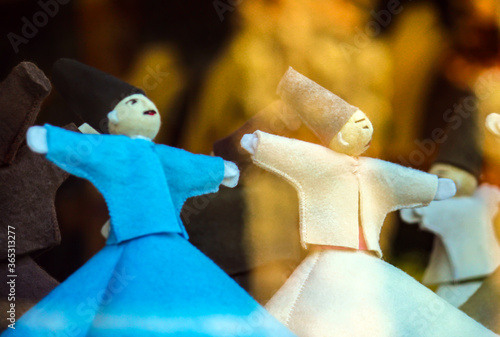 1 blue, 1 white small islamic whirling dervish figures photo