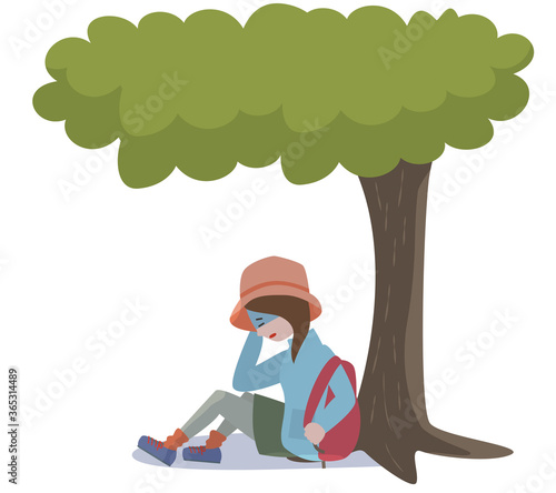山で体調を崩し木陰で休憩をする若い女性