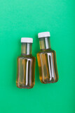 Bottles of ice tea, top view with green background