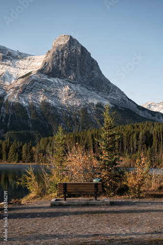 Mount Rundle with wooden bench on Rundle Forebay in autumn at Canmore