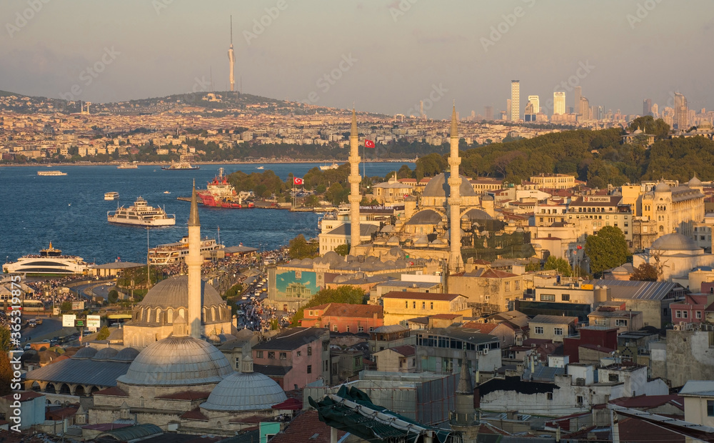 Istanbul in late afternoon sun taken from close to Suleymaniye mosque. Looking towards Sultanahmet it shows Rustem Pasa & Yeni mosques (foreground), Topkapi Palace (hill on right), Uskudar (background