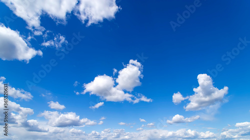 Blue sky with white clouds. Beautiful background.