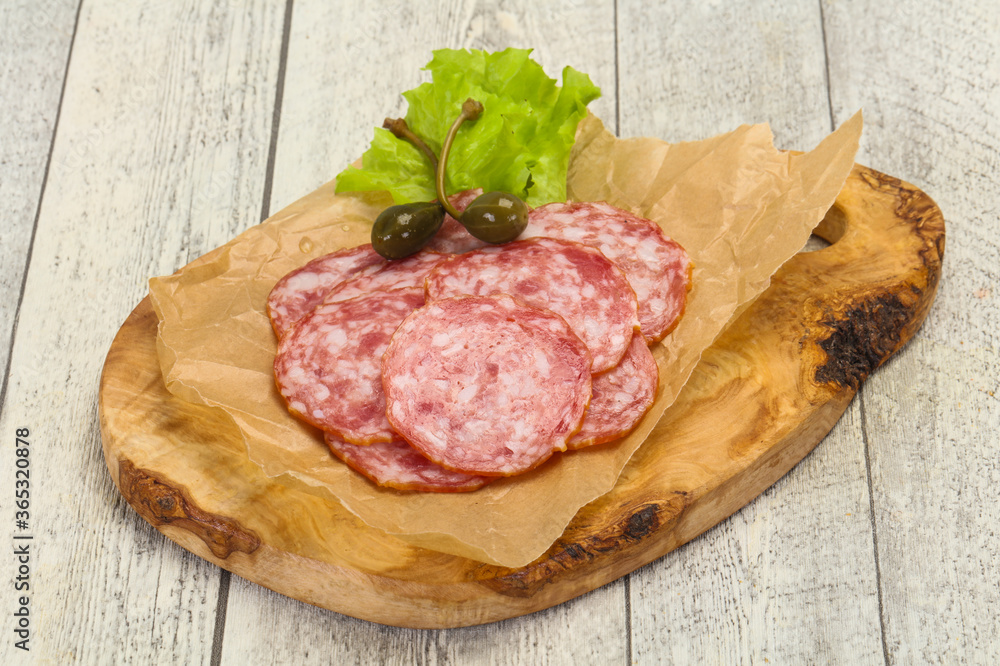 Spanish Salchichon sausage with salad Spanish Salchichon sausage with salad
