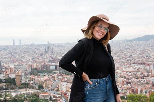 Canvas Print happy girl enjoys the views of a viewpoint in the city of Barcelona