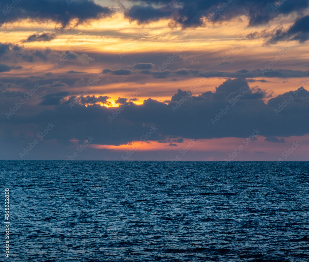 Beautiful cloudy sunset over Baltic sea. Natural background. Latvia. Evening calm on the Sea. Copy space for text Beautiful cloudy sunset over Baltic sea. Natural background. Latvia. Evening calm on the Sea. Copy space for text