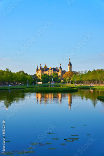 View of the Schwerin Castle over the blue water. Mecklenburg-Vorpommern, Germany