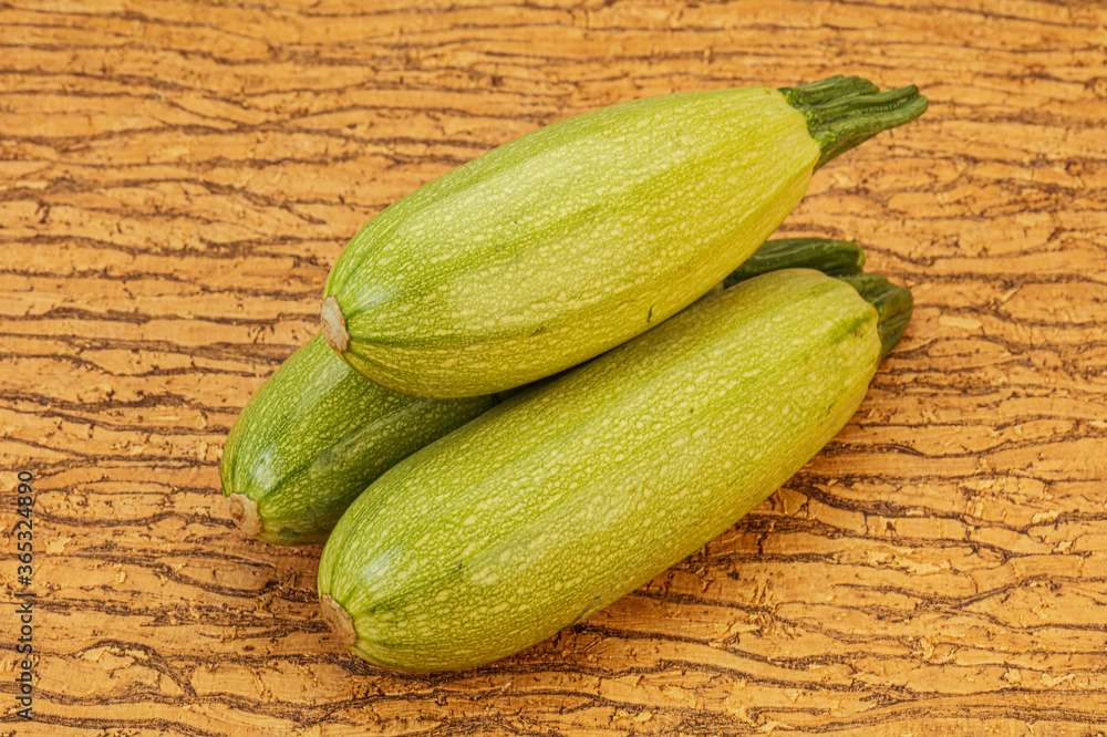 Young tasty zucchini over board Young tasty zucchini over board