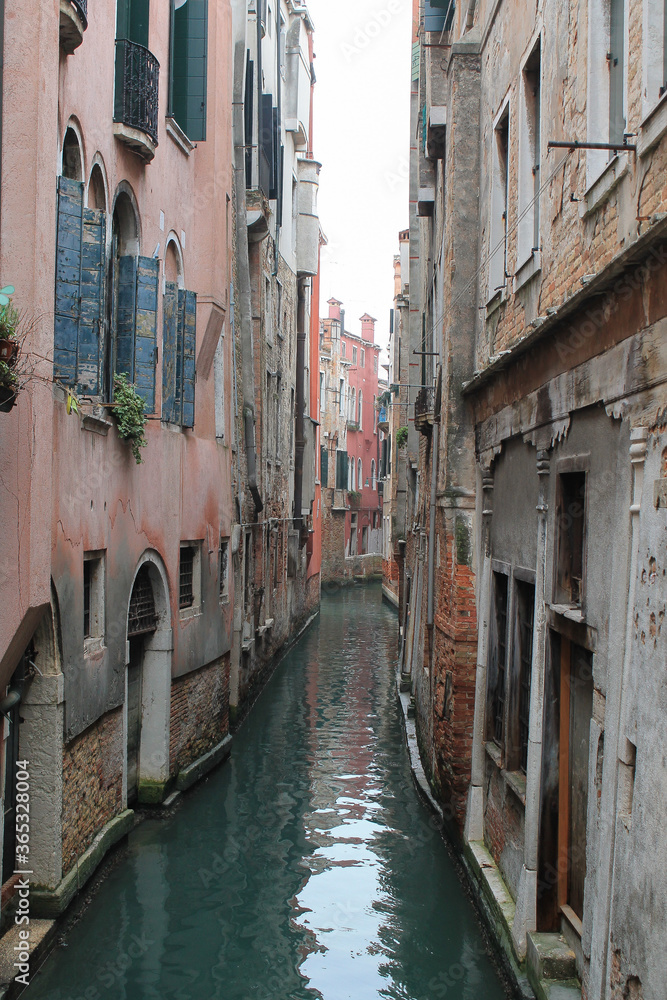canal in venice italy on foggy winter day