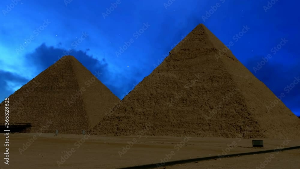 Giza pyramids at night,clouds running over Giza pyramids at night,clouds running over