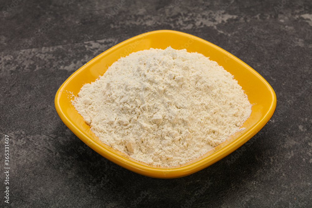 Wheat flour heap in the bowl Wheat flour heap in the bowl