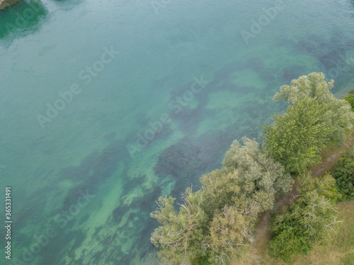 Aerial view of shallow water with sea floor visible from above. Clear water with impressive surface.