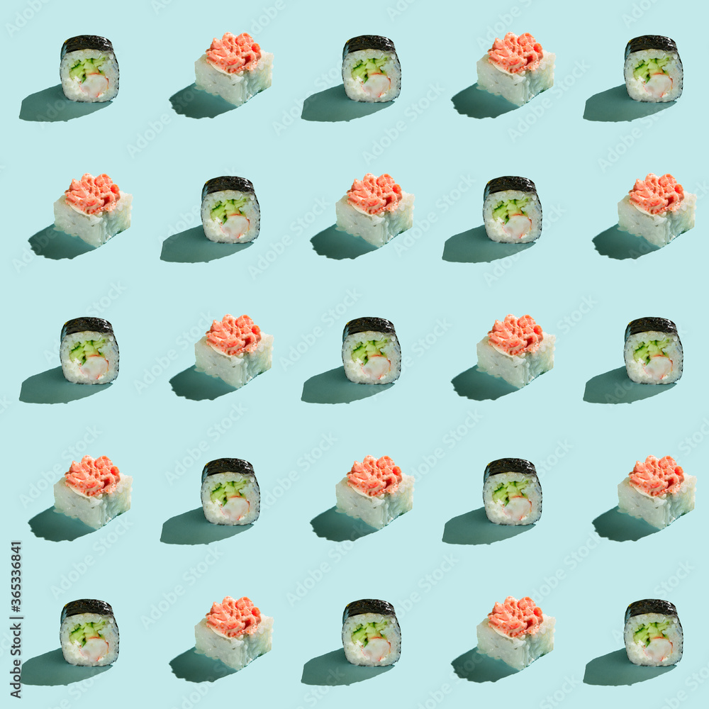 Pattern of sushi rolls on a light blue background Pattern of sushi rolls on a light blue background