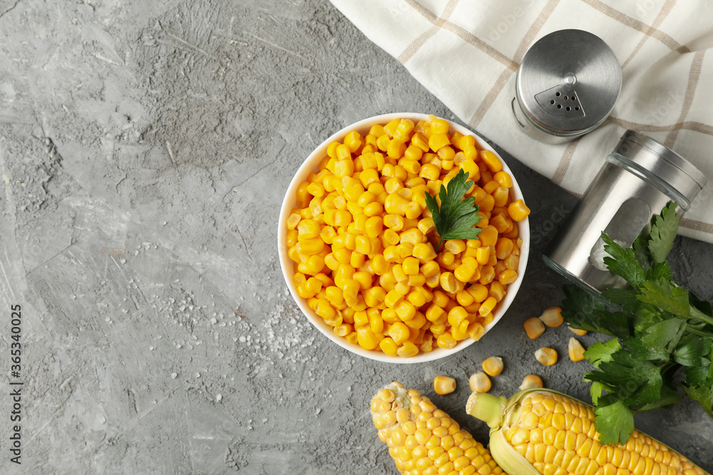 Composition with fresh raw corn on gray background, top view Composition with fresh raw corn on gray background, top view